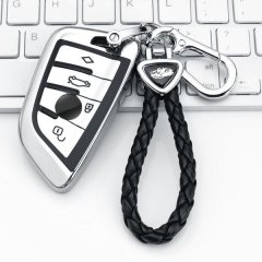 Stylish bmw key cover with leather fob protector, featuring a braided black strap and sleek metallic design for men.