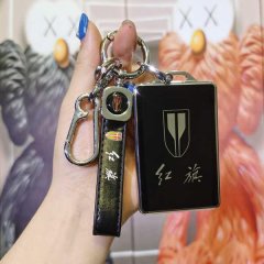 A hand holds a sleek hongqi hs5 card key cover, featuring a black leather remote shell with the iconic hongqi logo and elegan...