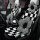 Black & white checkered plush car seat cushion with flower design – winter non-slip for comfortable driving.