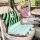 Adorable little monster backrest cushion with plush green and black stripes, soft light blue seat cover, and playful design f...