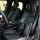 Elegant black leather car seats adorned with stylish bow headrest pillows, offering ice silk neck and lumbar support for ulti...