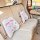 Miffy-themed car headrests with ice silk memory foam, featuring cute cartoon designs and happy miffy text on a luxurious beig...