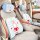 Authentic miffy car headrest and lumbar pillow set featuring a cute bunny design on a blue checkered pattern, perfect for com...