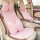 Elegant pink rabbit fur rose car headrest with plush neck pillow, perfect for winter comfort and style in your vehicle.
