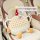 Plush monster car headrest & lumbar pillow with colorful design, featuring a cute monster character in a car seat for comfort...