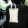 A cream-colored diamond-quilted leather car tissue box holder hangs from a headrest, offering dual-use functionality for in-c...