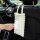 Puff & co. personalized car tissue box: a white, bubble-textured tissue holder attached to a car seat, with a hand pulling ou...
