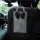 Elegant black and white houndstooth car tissue box holder with a bow, designed for convenient backseat storage in any vehicle...