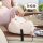 Cute capybara-shaped car tissue box holder, plush and soft, securely attached to a seatback for easy access while driving.