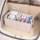 Oxford cloth car trunk storage box neatly organizes items in a spacious, beige trunk, featuring multiple compartments for bot...