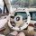 Checkered steering wheel cover with non-slip design, perfect for summer driving, shown in a stylish car interior.
