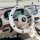 Checkered steering wheel cover with non-slip design, perfect for summer use in a modern car interior.