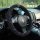 Elegant camellia embroidered steering wheel cover with cotton linen texture, enhancing car interior style and comfort.