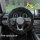 Cozy black rabbit fur steering wheel cover for warmth and grip, shown in an audi interior with plush texture and stylish desi...
