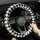 Black and white houndstooth rabbit fur steering wheel cover for a car, providing warmth and a non-slip grip.