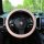 Elegant woven leather steering wheel cover for a porsche, offering non-slip grip and durable comfort in a stylish beige finis...