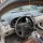 Interior view of a toyota corolla 2008–2013, showcasing the dashboard and steering wheel with a focus on the classic key shel...