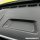 Close-up of a wuling starracer car dashboard featuring a textured storage compartment with a reserved opening for key cover i...