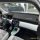 Interior view of the leapmotor t03 showcasing a sleek dashboard with a central touchscreen display, patterned seats, and a su...