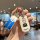 A hand holds a doraemon-themed key cover for honda vehicles, featuring a foldable 2-button shell design with a playful cartoo...