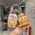 A hand holds a spongebob-themed car key cover featuring a cartoon design and a 3d spongebob charm, perfect for fans of the ch...