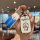 A hand holds a changan lumin car key cover featuring a cute pastel shell design with doraemon graphics, perfect for cs15 owne...