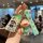 A hand holds a cartoon-themed key cover and charm set for lexus vehicles, featuring vibrant designs of a popular animated cha...