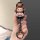 Hand holding a stylish aito m7 m9 key cover featuring a cute bear character in a red-and-white striped outfit, crafted from a...