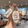 A hand holds a gac trumpchi yabo key cover featuring a matte finish and a doraemon design, complete with a matching doraemon-...