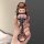 Hand holding a gac trumpchi yingbao car key cover featuring a cute bear-themed design with a red-and-white striped outfit, at...