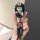 A hand holds a stylish gac aion v key cover featuring a cute cartoon character in a black outfit, attached to a get rich keyc...