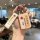 A hand holds a stylish volvo xc60 car key cover with and inscriptions, featuring a matching wrist strap for added con...