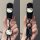 A hand holds a black mazda cx-4 key cover featuring a white hello kitty design with a bow, attached to a lanyard with a get r...