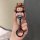 Hand holding a honda cr-v 11 car key cover featuring a cute bear character in a striped outfit, with a shiny black key ring.