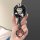 A hand holds the jetour x-traveler car key cover, featuring a stylish black and white design with a cute cartoon character we...
