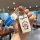 Hand holding a doraemon-themed key cover for land rover range rover models, featuring a blue and white design with the iconic...