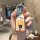 A hand holds a volkswagen id.3 key cover featuring a spongebob design, with a tpu shell case for golf 8 & id.4 crozz, showcas...