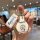 A hand holds a doraemon-themed key cover and strap, featuring a cute cartoon design on a leather shell case, perfect for bmw ...