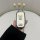 A hand holds a toyota sienna key cover featuring cute bear designs, including a larger bear in blue shorts and a smaller bear...
