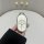 A hand holds a sleek, white nio es6 car key cover with a minimalist design, featuring three buttons for lock, unlock, and tru...