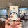 A hand holds a buick e5 card key cover featuring a cute doraemon design, perfect for protecting your 2024 e4 nfc car key fob ...