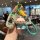 Hand holding a honda civic 11th gen key cover featuring a cartoon design, paired with a cute character charm and green lanyar...