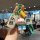 A hand holds a volkswagen santana car key cover featuring a cartoon design with a character in a green shirt and blue pants, ...