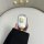 A hand holds a white car key cover featuring cute yellow bear designs, perfect for the nuonu universe pro sunny. the cover is...