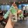 A hand holds a gac trumpchi gs4 key cover featuring a cartoon design with a character in green pajamas, accompanied by a matc...