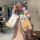 A hand holds a mercedes-benz c260l car key cover featuring a spongebob squarepants design, paired with a matching wrist strap...