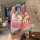 A hand holds a bmw 5 series car key cover featuring patrick star from spongebob, paired with a matching keychain charm, set a...