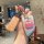 A hand holds a stylish car key cover featuring patrick star from spongebob squarepants, with a vibrant design and a matching ...