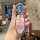 A hand holds a nissan sylphy 14th gen car key cover featuring a cute cartoon design of patrick star with hi! text, encased in...