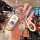 A hand holds a volkswagen magotan b7 car key shell case with a leather wrap, featuring a cartoon design and vw logos, display...